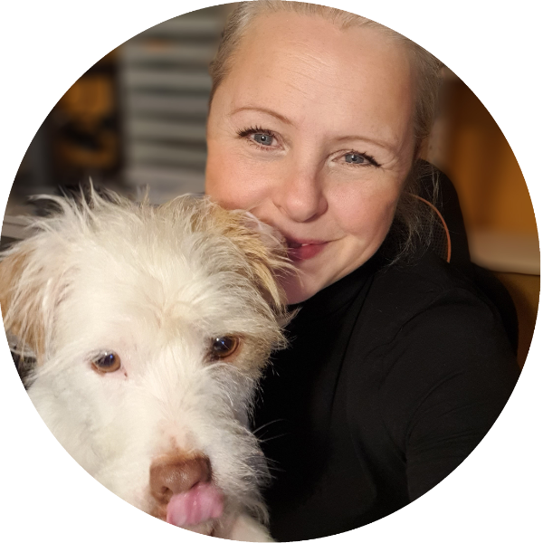 Hannah and her dog, Spike, in her home office